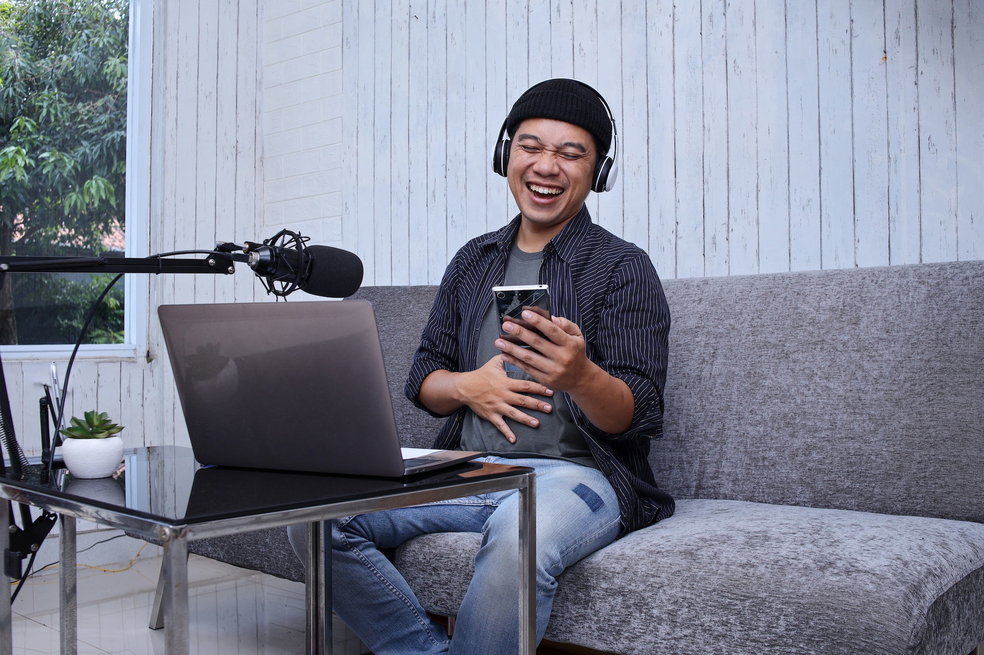 male-podcaster-laughing.jpg